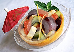 Fresh fruits salad in a grapefruit skin