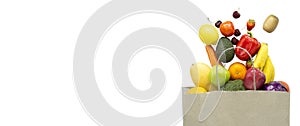 Fresh fruits and vegetables in paper bag on white background , banner, copy space. Shopping food supermarket.Healthy vegan,image