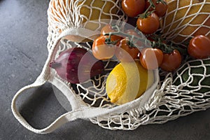 Fresh fruits and vegetables in reusable shopping bag