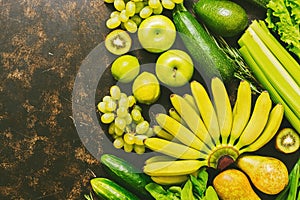 Fresh fruits and vegetables are yellow and green. Top view, copy space.