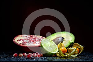 Fresh fruits with waterdrops on them and knife