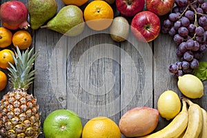 Fresh fruits on wooden boards background