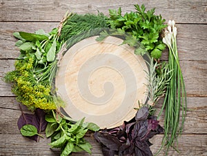 Fresh garden herbs and cutting board