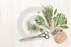 Fresh garden herbs on wooden table