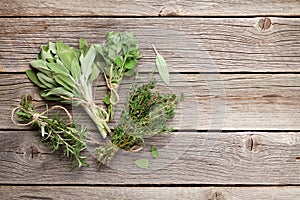 Fresh garden herbs on wooden table