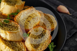 Fresh Garlic Bread, toast on black plate