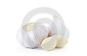 Garlic bulbs and cloves on white background