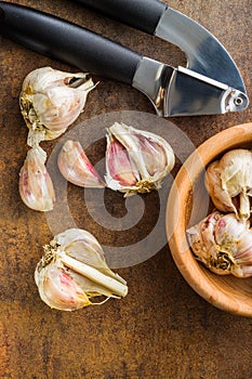 Fresh garlic and garlic presser.