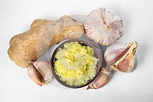 Fresh garlic and ginger isolated on white. Natural cold remedies