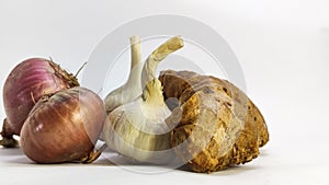 fresh garlic,ginger and onion on a white isolated surface