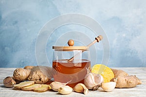 Fresh garlic and other natural cold remedies on table