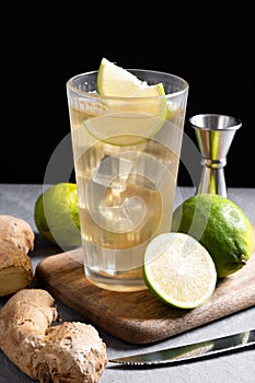 Fresh ginger ale drink on gray background