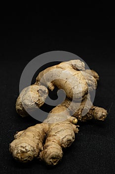 Fresh ginger rhizome isolated on Black background.