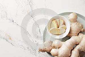 Fresh ginger root in a bowl, for the article, winter immunity, healthy medicine,