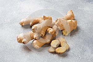 Fresh ginger root on grey background. Copy space