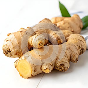 Fresh ginger root isolated on white surface
