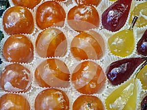 Fresh glazed fruit sweet on display in pastry shop