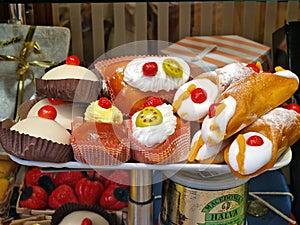 Fresh glazed fruit sweet on display in pastry shop