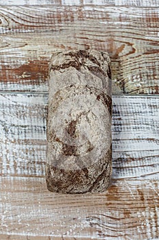 Fresh gluten free bread on a wooden surface in provence style