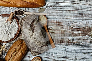 Fresh gluten free bread on a wooden surface in provence style