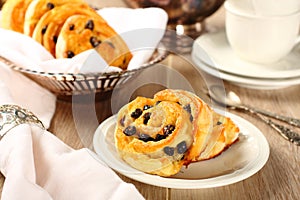 Fresh gluten free sweet swirl buns with raisins