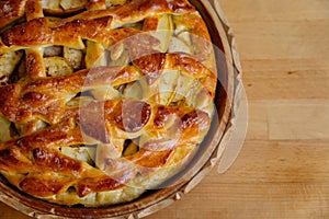 Fresh golden brown homemade tasty apple pie decorated with lattice overhead shot sugar crust, sweet dessert fall baking concept,