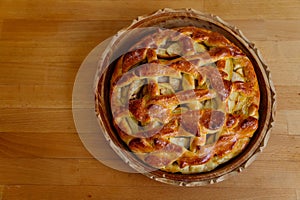 Fresh golden brown homemade tasty apple pie decorated with lattice overhead shot sugar crust, sweet dessert fall baking concept,