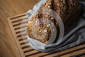 Fresh grain bread on cutting board