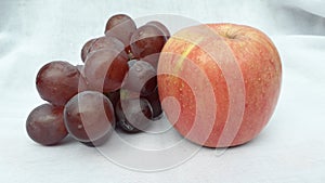 Fresh grape and apple or anggur and apel in indonesia on white background