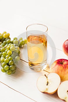 Fresh grape fruits with green leaves isolated on white background. bunch of green grapes and juice in the glass, pitcher