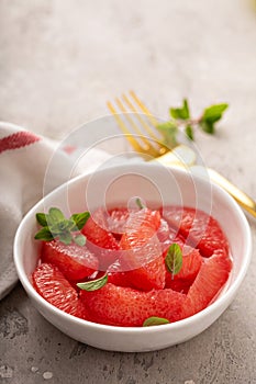 Fresh grapefruit slices in a bowl
