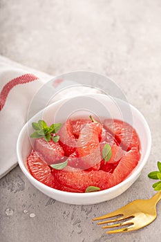 Fresh grapefruit slices in a bowl