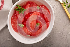 Fresh grapefruit slices in a bowl