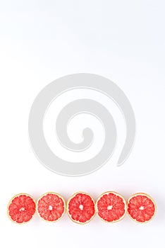 Fresh grapefruits isolated on white background with copyspace