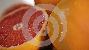 Fresh grapefruits on the plate, prepared birthday table with fruits closeup