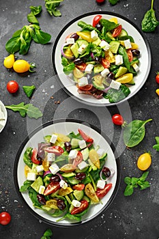 Fresh Greek salad with cucumber, cherry tomato, lettuce, red onion, feta cheese and black olives. Healthy food