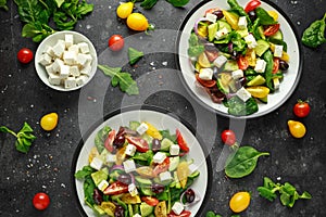 Fresh Greek salad with cucumber, cherry tomato, lettuce, red onion, feta cheese and black olives. Healthy food