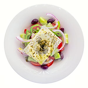 Fresh Greek salad with onion, bell pepper, feta cheese, tomatoes and olives isolated on white background. Top view