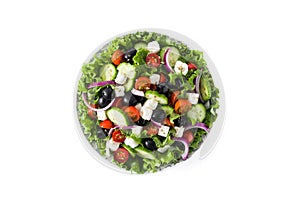 Fresh Greek salad in Plate with black olive,tomato,feta cheese, cucumber and onion isolated