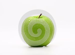 Fresh green apple with water drops on white background