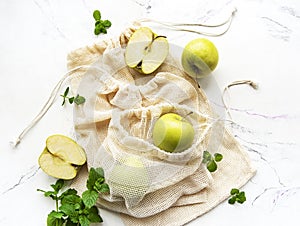 Fresh green apples in a mesh bags