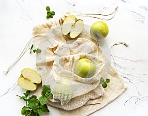 Fresh green apples in a mesh bags