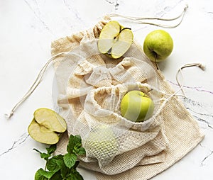 Fresh green apples in a mesh bags