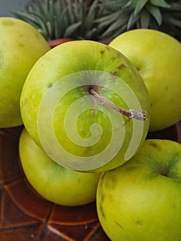 Fresh green apples on a tray photo