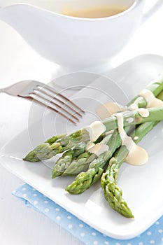 Fresh green asparagus with hollandaise