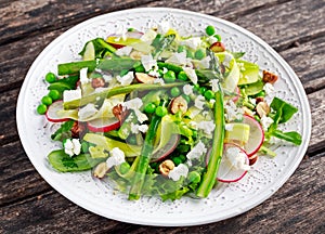 Fresh Green Asparagus salad witch Goat Cheese, peas, radishe, zucchini, lettuce and Hazelnuts.