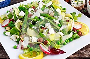 Fresh Green Asparagus salad witch Goat Cheese, peas, radishe, zucchini, lettuce and Hazelnuts.