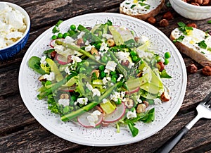 Fresh Green Asparagus salad witch Goat Cheese, peas, radishe, zucchini, lettuce and Hazelnuts.