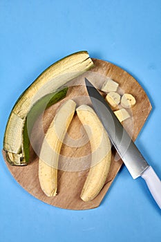 Fresh green banana on blue background, maqueno barraganete dominico