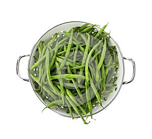 Fresh green beans in colander isolated on white, top view